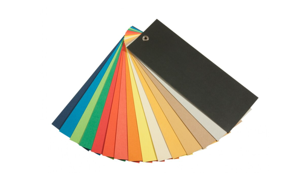 A color fan deck with various paper samples splayed out